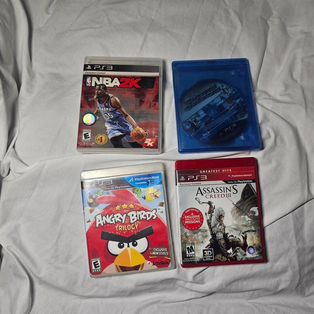 Ps3 angry birds, assassin's creed, NBA, sports champion video gane bundle